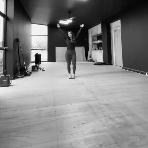 Nadia in the empty studio space during construction