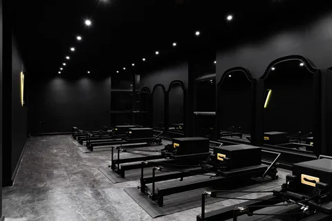 The finished Vitális studio with reformers and arched mirrors