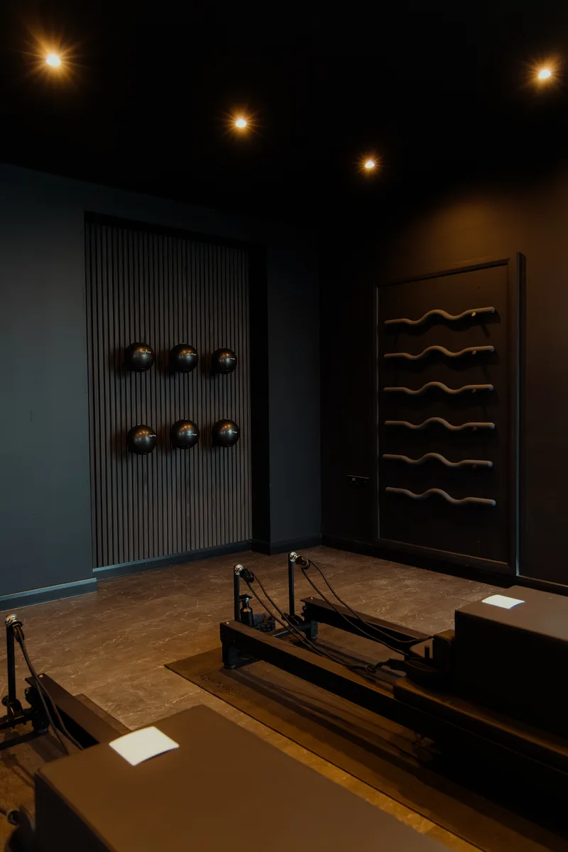 Reformer equipment and studio wall at Vit&aacute;lis Studios